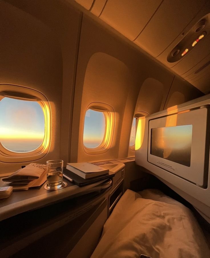Golden hour light across a business class suite